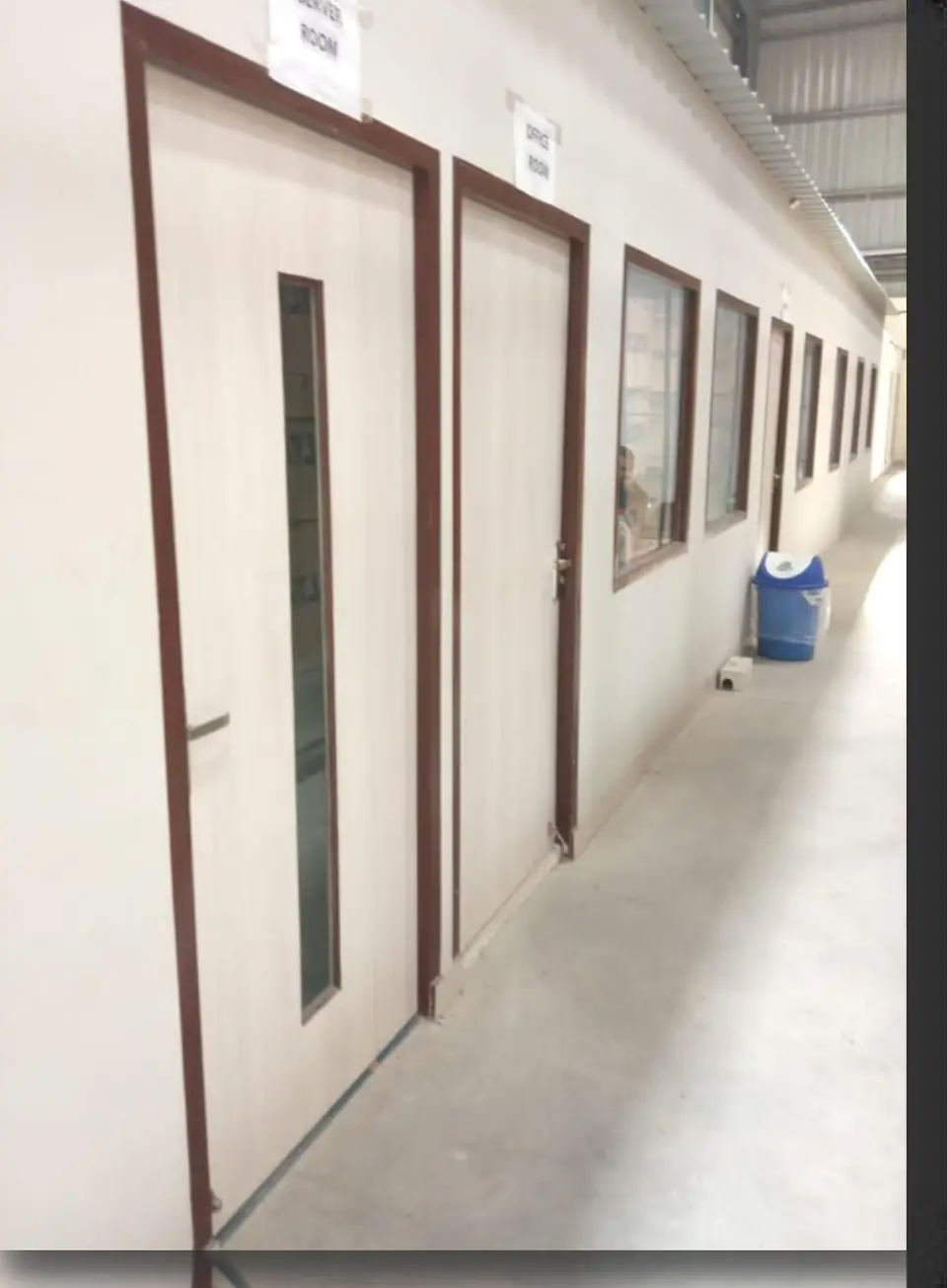 Single leaf flush doors in corridor - MEP project by Chamunda Electromech