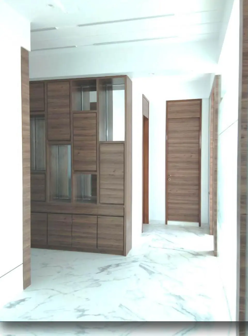 Laminated partition with storage - MEP project by Chamunda Electromech
